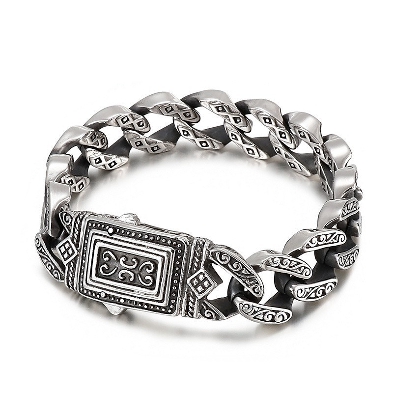 Elegant Herrarmband Med Gjutna Charms I Titan Elegant Herrarmband Med Gjutna Charms I Titan